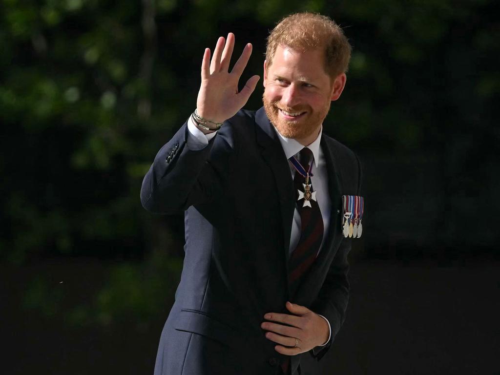 Prince Harry waves as he arrives to attend a ceremony marking the 10th anniversary of the Invictus Games, at St Paul's Cathedral in central London. Picture: Justin Tallis/AFP