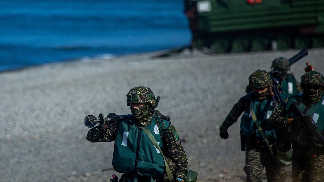 Taiwanese soldiers disembark from AAV7 amphibious assault vehicles during the Han Kuang military exercise, which simulates China's People's Liberation Army (PLA) invading the island (Photo by Annabelle Chih/Getty Images)