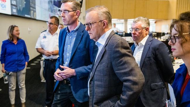 Mr Perrottet and Mr Albanese receive a briefing from the SES. Picture: James Brickwood