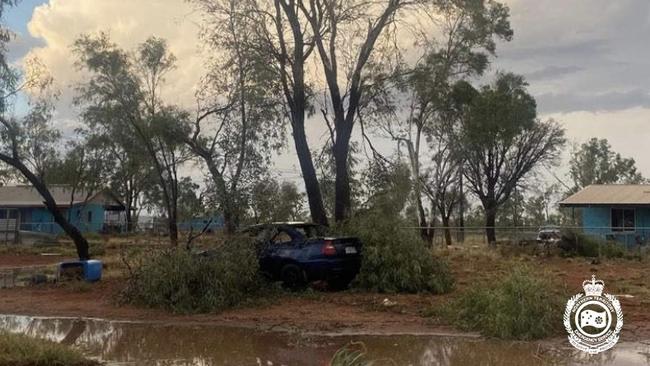 A car became stuck between tree debris. Picture: NT Police