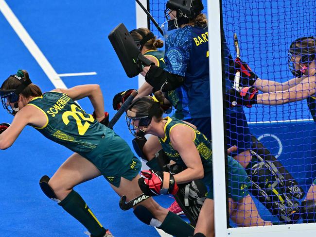 The Hockeyroos defend a corner wearing protective masks Charter was instrumental in bringing into the game. Picture: Miguel Medina/AFP