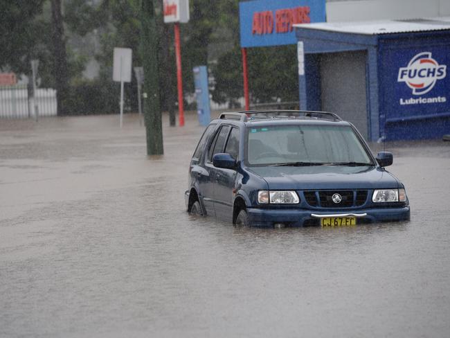 Car is left submerged as the centre of Lismore goes underwater late Thursday afternoon.