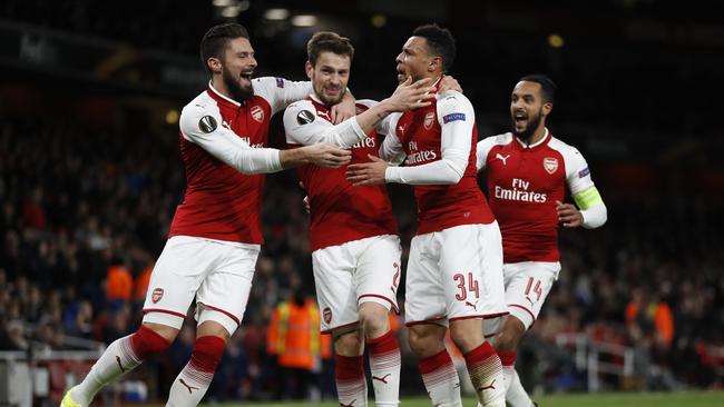 Arsenal's Mathieu Debuchy, second left, celebrates scoring his sides first goal.