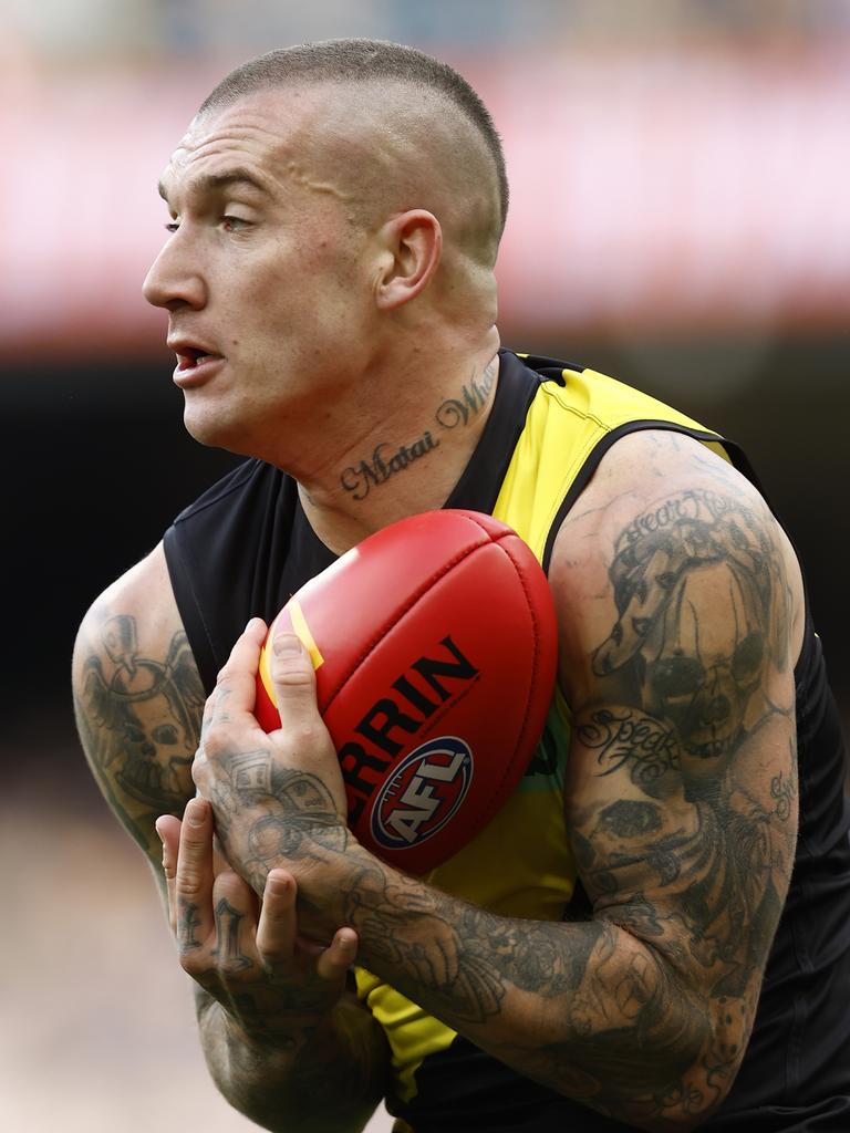 Dusty marks the ball. Photo by Darrian Traynor/Getty Images