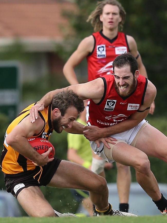 Andrew McInnes tackles Box Hill’s Sam Iles.