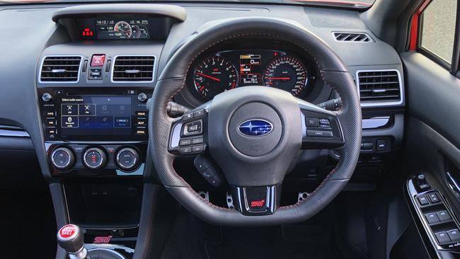 The WRX gets Recaro seats and a sports steering wheel. Picture: Joshua Dowling.