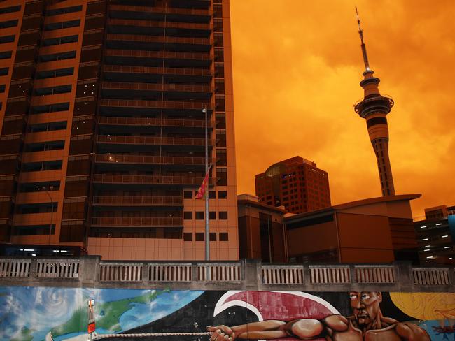 An orange glow darkens the sky in Auckland, New Zealand. Picture: Fiona Goodall/Getty