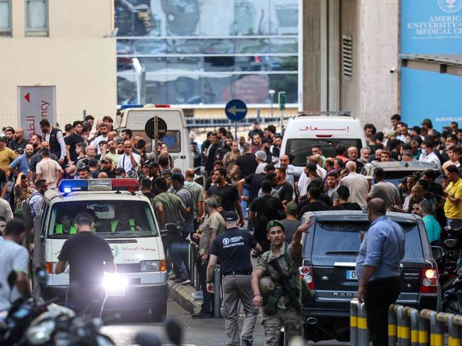 Ambulances are surrounded by people at the entrance of the American University of Beirut Medical Center, on September 17, after Hezbollah members' pagers simultaneously exploded in Lebanon. Picture: Anwar Amro/AFP