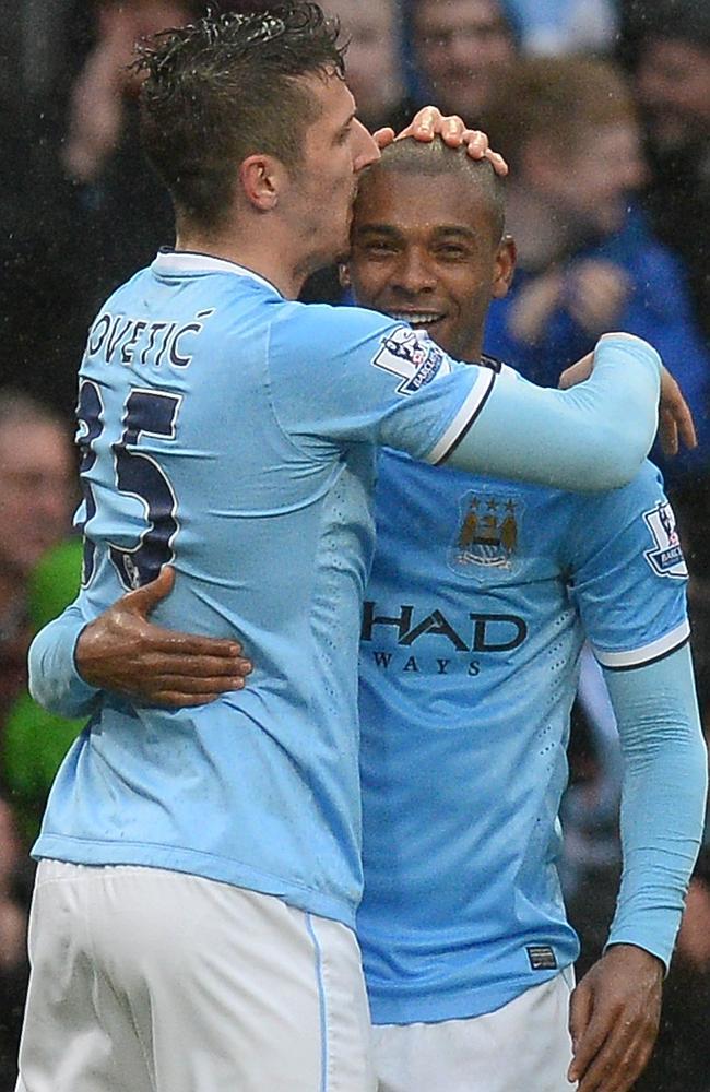 Fernandinho celebrates with Stevan Jovetic after grabbing City’s fourth.