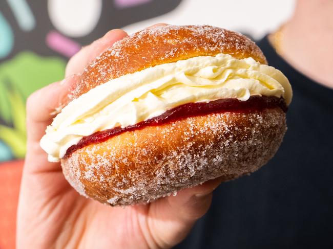 David Matkovic, owner of Brighton Jetty Bakery holding a kitchener bun at the bakery in Brighton/ Kaurna Yarta on Friday, May 12, 2023. (The Advertiser/ Morgan Sette)