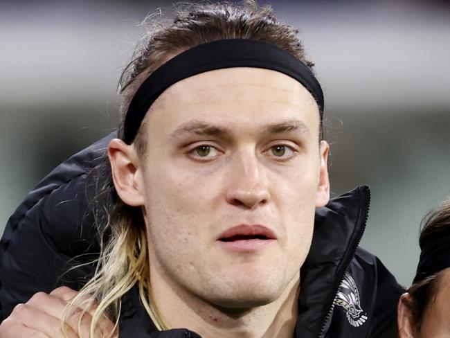 MELBOURNE, AUSTRALIA - AUGUST 11: Jack Ginnivan of the Magpies shares an embrace with Darcy Moore of the Magpies as Moore is subbed out of the game during the round 22 AFL match between Collingwood Magpies and Geelong Cats at Melbourne Cricket Ground, on August 11, 2023, in Melbourne, Australia. (Photo by Darrian Traynor/Getty Images)