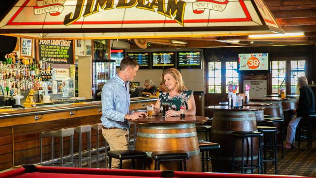 Matt McGuire, owner of Logan Village Hotel, and Logan City Council’s Division 4 Councillor Laurie Koranski in the rustic pool room. PHOTO: AAP/Richard Walker