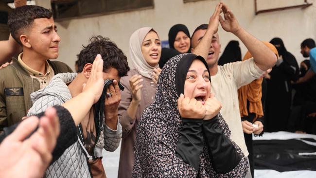 Palestinians mourn relatives killed in Israeli bombardment, at the al-Najjar hospital in Rafah on Monday. Picture: AFP