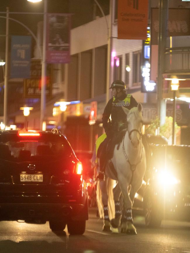 Police on horseback on Hindley Street. Picture: Morgan Sette