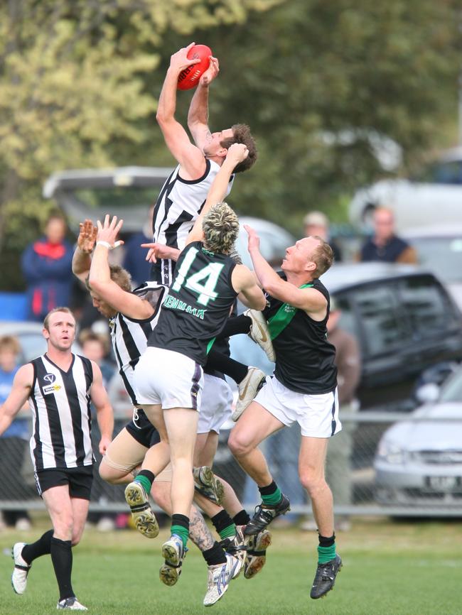 Narre Warren's Lee Clark takes a huge mark.