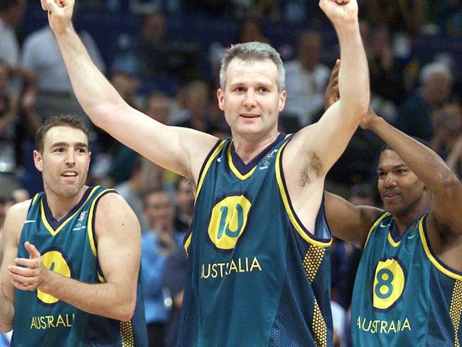 SEPTEMBER 28, 2000 : Andrew Gaze flanked by Jason Smith (L) & Ricky Grace following defeat of Italy in Sydney 2000 Olympic Games match Australia (Boomers) v Italy 28/09/00. Pic Colleen Petch.BasketballSydney2000