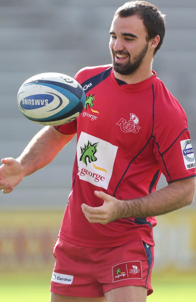 Nick Frisby juggles a ball during Reds training at Ballymore.