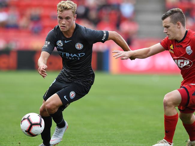 ADELAIDE, AUSTRALIA - DECEMBER 16: Nathaniel Atkinson of Melbourne City competes with Scott Galloway of Adelaide United   during the round eight A-League match between Adelaide United and the Melbourne City at Coopers Stadium on December 16, 2018 in Adelaide, Australia.  (Photo by Mark Brake/Getty Images)