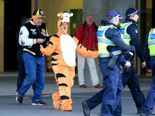 Brenda Hilton chases some police. Picture: Mark Stewart