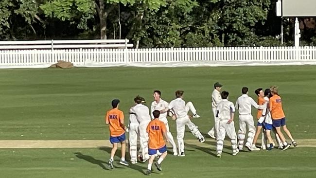 The Ashgrove cricket team celebrating Frank Piper's heroics.