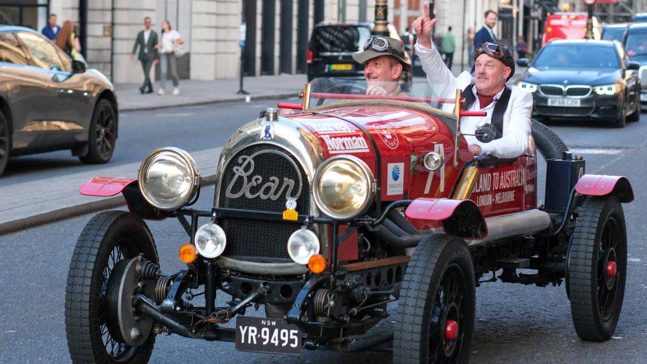 Daily Telegraph cartoonist Warren Brown (left) and journalist Matthew Benns in their vintage Bean 14 car leaving London. Picture: Jacquelin Magnay