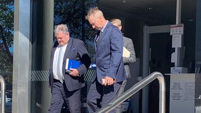 Raymond Charles Matthews (right) walks out of Maroochydore Magistrates Court with his lawyer (left) after being sentenced for filming his ex-partner without her permission during sex. Picture: Aisling Brennan