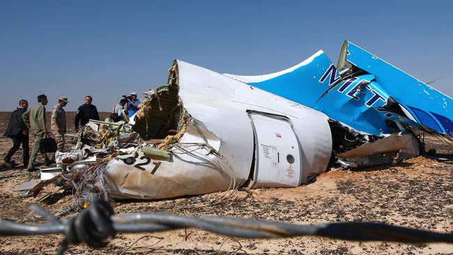 Investigators examine the site where a Russian aircraft crashed in Egypt's Sinai Peninsula in October 2015. Picture: TASS/Barcroft Media/Barcroft Media via Getty Images