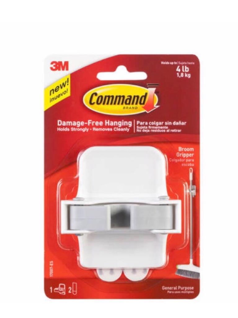 A Command Self Adhesive Broom Holder is available at Kmart for $8.