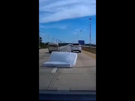 Dashcam captures moment mattress causes terrifying crash