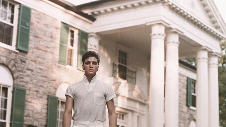 Elvis Presley strolls the grounds of his Graceland estate circa 1957.