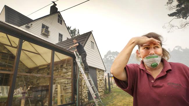 Kermandie River Rd resident Melanie Kikoudis, who lives in the vicinity of the Tahune bushfire, keeps a wary eye out for an uncontrolled blaze heading towards Geeveston in Tasmania’s far south. Picture: CHRIS KIDD