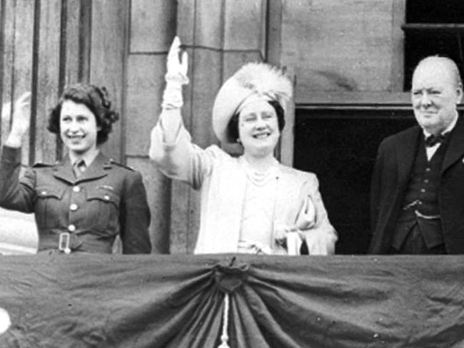 In this May 8, 1945 photo Britain's PM Winston Churchill joins Princess Elizabeth (left) and Queen Elizabeth (the late ‘Queen Mum’). Picture: AP