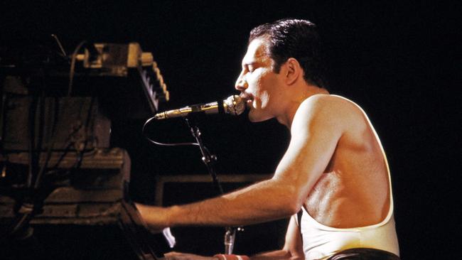 September 1984: Freddie Mercury, lead singer of Queen performs during a concert. Picture: AFP 