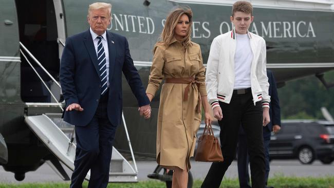 Donald and Melania Trump and their son Barron land at Morristown airport in New Jersey on Monday (AEST). Picture: AFP