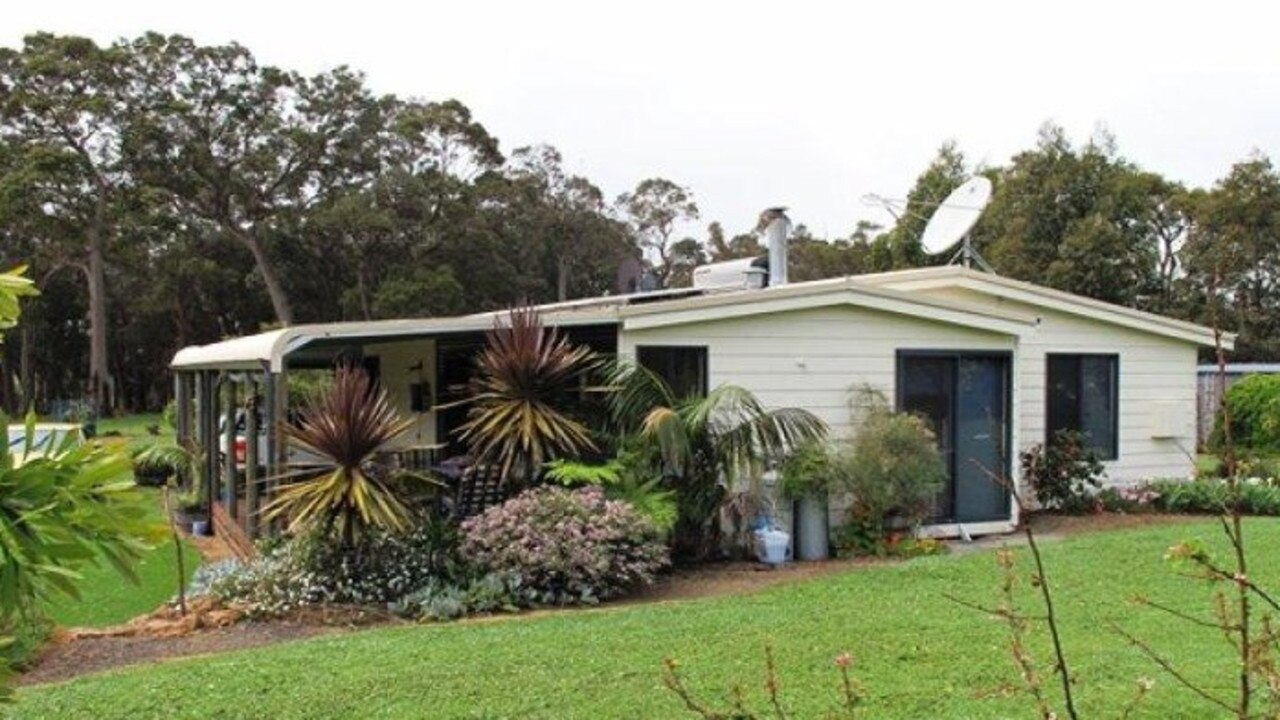 Shrubs and plants fringed the main home on the property.