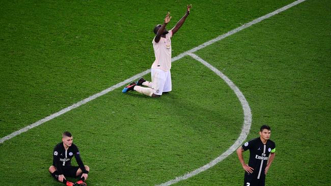 Manchester United forward Romelu Lukaku celebrates as PSG players are left stunned at full-time in Paris. Picture: AFP