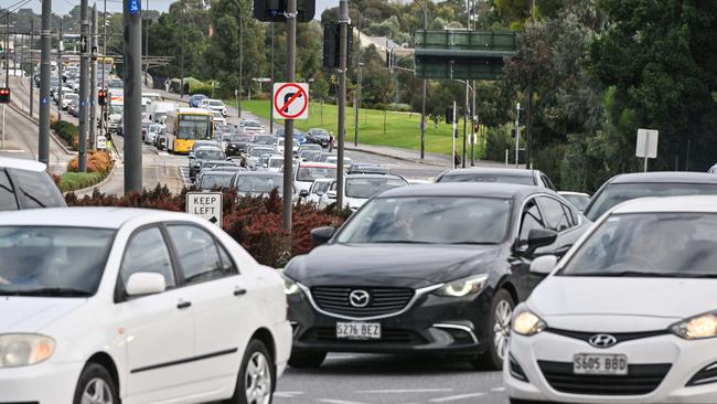 Traffic was delayed during peak hour traffic on Wednesday when protesters abseiled off a bridge. Picture: NCA NewsWire / Brenton Edwards