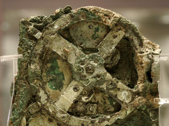 A fragment of the 2,100-year-old Antikythera Mechanism, believed to be the earliest surviving mechanical computing device, is seen at the National Archaeological Museum in Athens, Thursday, Nov. 30, 2006. The bronze system of cogs and wheels was found in a Roman wreck off southern Greece in 1900. It is the focus of a two-day conference starting in Athens late Thursday, with the participation of scientists from Greece, Britain, the U.S. and other countries. Ancient chronometer. (AP Photo/Thanassis Stavrakis)