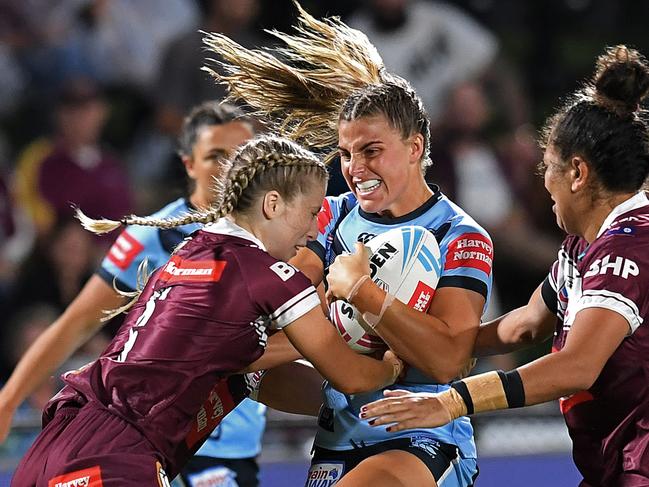 The Blues (centre) may be playing for less money than their Maroon counterparts in 2022. Picture: Dan Peled/Getty Images