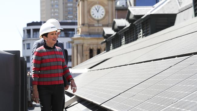 City of Sydney Lord Mayor Clover Moore inspecting solar panels on the roof of Town Hall. Picture: Dylan Robinson