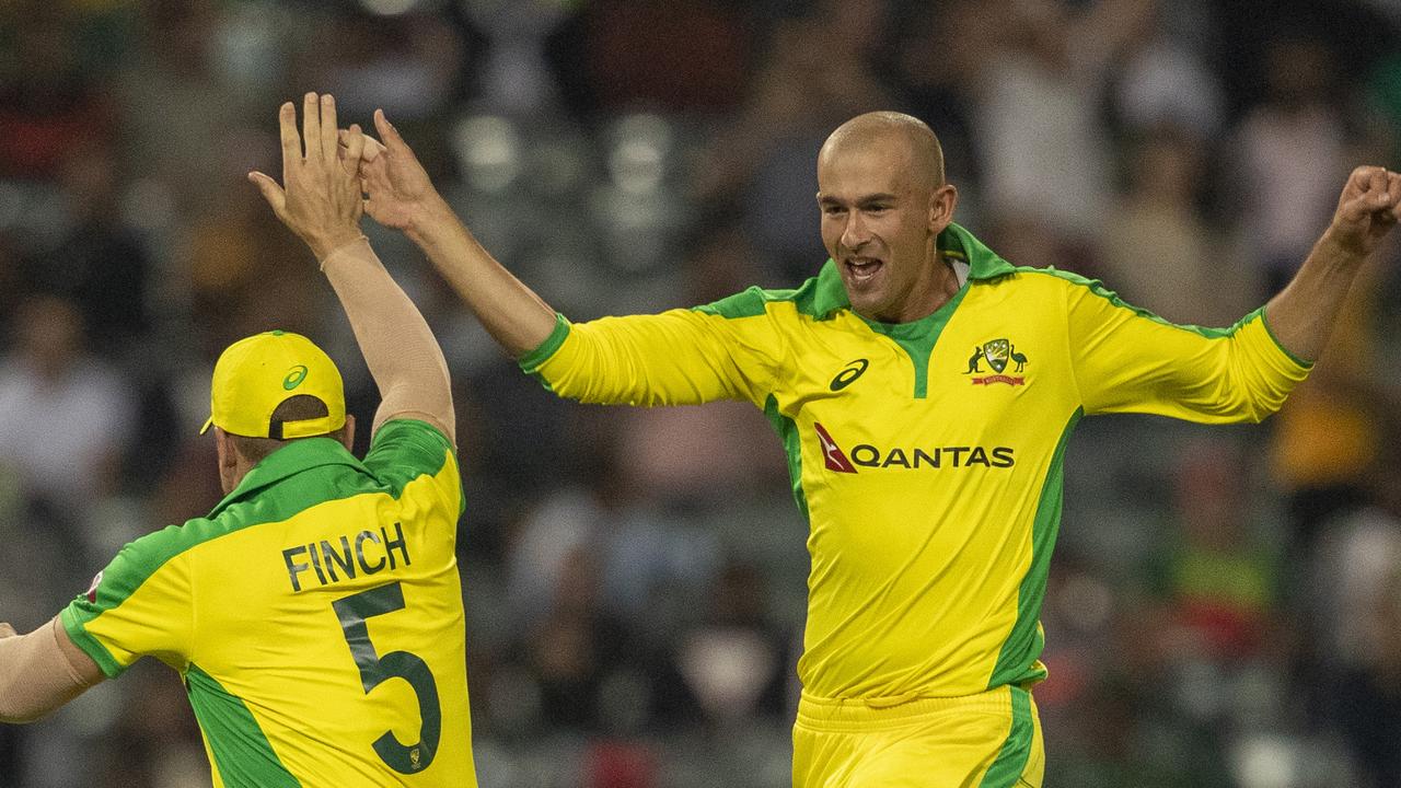 Ashton Agar celebrates his hat-trick.