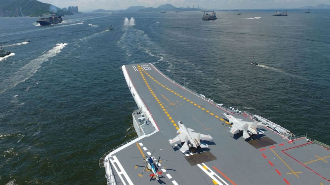 J-15 “Flying Shark'' fighters sit in their launch positions aboard the People’s Liberation Army Navy aircraft carrier Liaoning. Picture: Xinhua