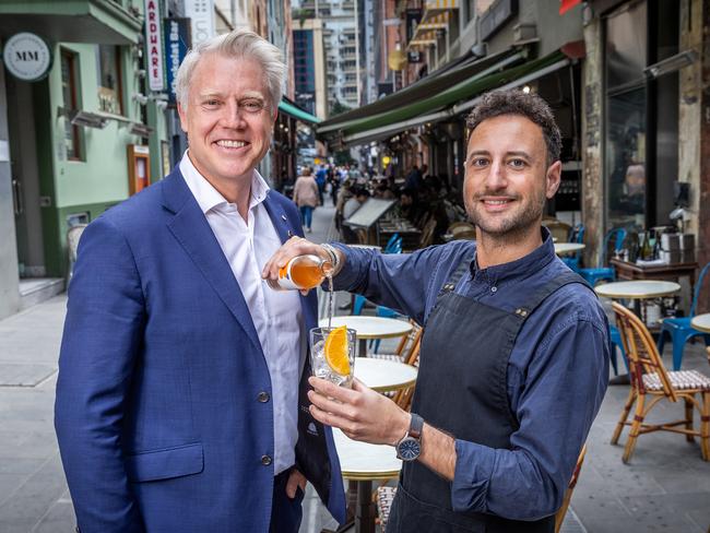 Lord mayoral candidate Arron Wood with Miguel Ramirez from Kirks Wine Bar in Hardware Lane. Picture: Jake Nowakowski