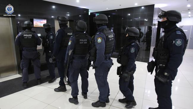 The police raid at an apartment on Sussex St, Sydney.