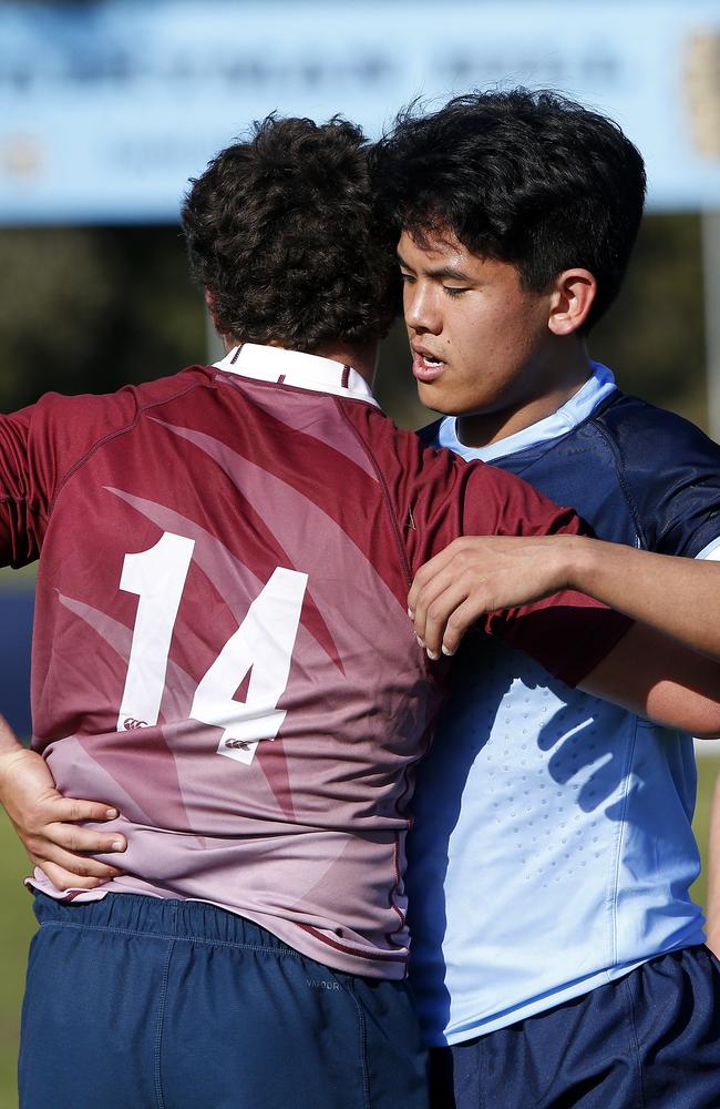 Qld Reds winger Rocco Gollings and Waratahs' Hwi Sharples congratulate each other after an Academy clash last year.