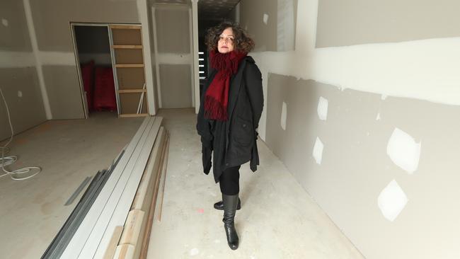 Nicole Ferguson in her unfinished Mt Barker investment house is among 90 customers impacted by the collapse of Coast to Coast Homes. Picture: Tait Schmaal