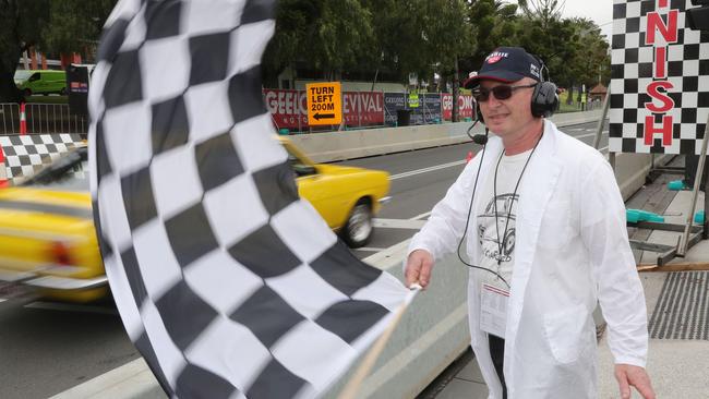 Geelong Revival. Jeremy Coakley waving the Chequered flag Picture: Mark Wilson