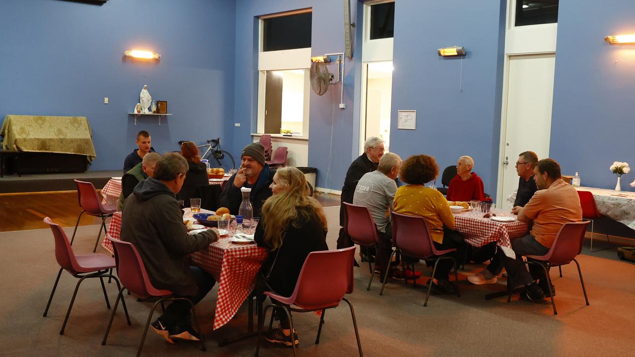 People eating at the Order of Malta soup kitchen in Bondi, one of the many services helping the homeless across Sydney. Picture: Richard Dobson