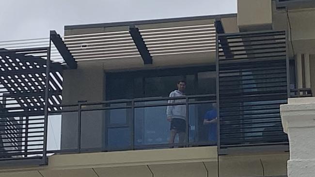 World number one tennis player Novak Djokovic on the balcony at his North Adelaide hotel on Sunday, January 17. Picture: Melissa Jewell