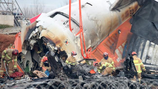 Firefighters work at the wreckage of a passenger plane at Muan International Airport on December 30, 2024 in Muan-gun, South Korea. Picture: Chung Sung-Jun/Getty Images